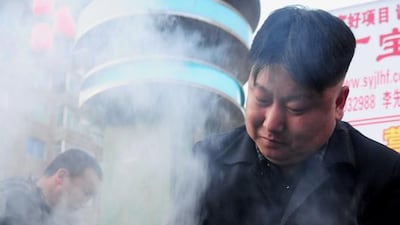The Kim Jong Un doppelganger cooks chicken. AFP Photo