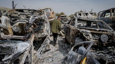 Cars in this scrapyard were torched in Hawara in the West Bank. AP