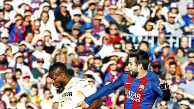 Villarreal striker Cedric Bakambu vies with Barcelona defender Gerard Pique during their match at Camp Nou in Barcelona on May 6, 2017. Andrea Dalmau / EPA