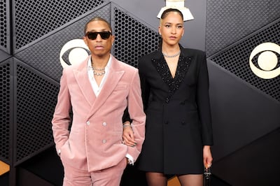 Pharrell Williams and Helen Lasichanh on the red carpet at the 68th Annual Grammy Awards in Los Angeles. Reuters