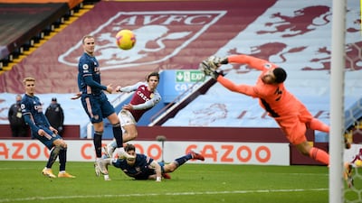Arsenal goalkeeper Mathew Ryan saves a shot from Aston Villa's Jack Grealish. Reuters