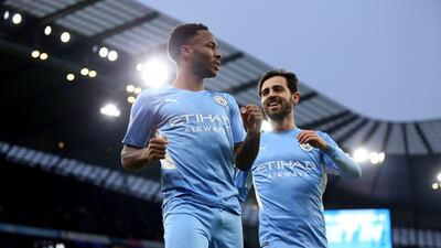 City's Raheem Sterling celebrates with Bernardo Silva after scoring. PA