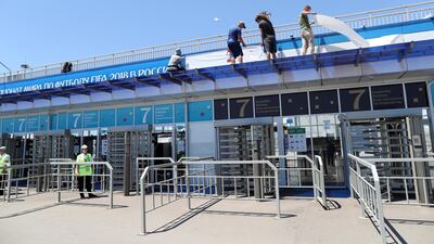 Russian workers at Sochi stadium in Russia. EPA