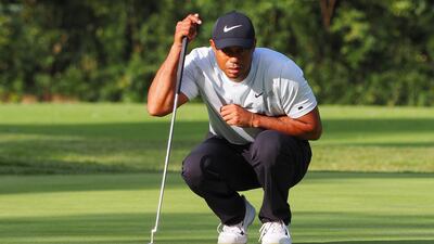 Leader Tiger Woods checks the line for a birdie on the 13th hole during the second round of the PGA Zozo Championship golf tournament in Inzai. AFP