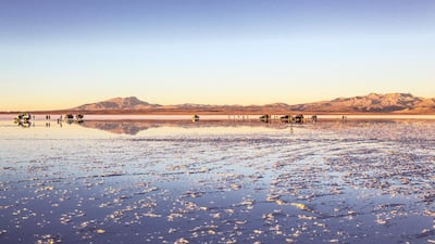 9. Stand on the mirror-like Salar de Uyuni in Bolivia, it's the biggest salt lake in the world.