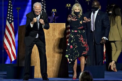 US President-elect Joe Biden and wife Jill Biden gesture to the audience during an election event. Bloomberg