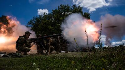 Ukrainian soldiers shoot an SPG-9 recoilless gun during training in the Kharkiv region of Ukraine. AP