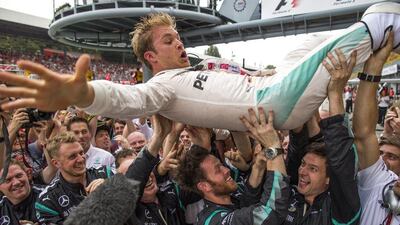 Nico Rosberg of Mercedes celebrates his victory with teammates following the Formula One Italian Grand Prix. Srdjan Suki / EPA