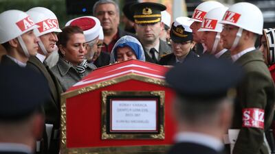 Turkish soldiers salute as Fatma Karaca, mother of Koray Karaca, a Turkish soldier who was killed in cross-border clashes with Kurdish Popular Protection Units (YPG) forces at Afrin on 11 February 2018. EPA