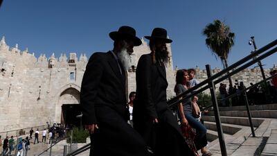 Men walk by Damascus Gate in Jerusalem's old city. EPA