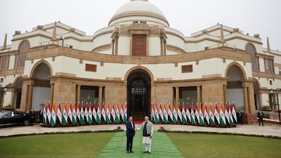 The leaders pose in front of Hyderabad House, the state guest house of India's Prime Minister. Reuters
