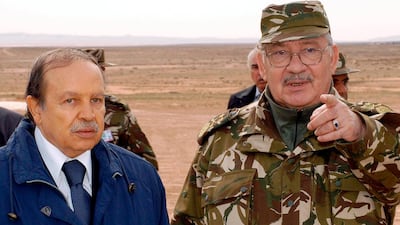 Gen Gaid Salah, right, gestures as he speaks with former Algerian President Abdelaziz Bouteflika in Hassi Bahbah, Algeria, in 2005. AP Photo