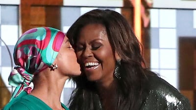 Alicia Keys and Michelle Obama share a touching moment. AP