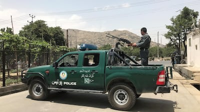 An Afghan police officer keeps watch at the site of a blast in Kabul, Afghanistan. Omar Sobhani / Reuters