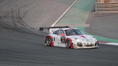 Martin Ragginger, below second from left, and his Fach Auto Tech team led in qualifying in the Porsche car. Jeffrey E Biteng / The National