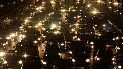 Commuters travel through a traffic jam on their way to New Delhi from Gurgaon. Chandan Khanna/AFP
