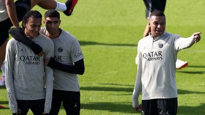 Left to right: Paris Saint-Germain's Ethan Mbappe, Achraf Hakimi and Kylian Mbappe during a training session at Poissy, west of Paris, on September 18, 2023. PSG take on Borussia Dortmund in the Champions League on Tuesday. AFP