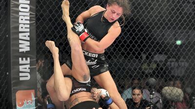 Lucie Bertaud (standing) and Kelig Pinson in the flyweight division. Chris Whiteoak / The National