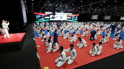 Pupils from schools under the purview of Abu Dhabi Education Council make an attempt to break the world record of the largest jiu-jitsu class at the Abu Dhabi National Exhibition Centre on Wednesday. Christopher Pike / The National