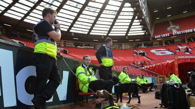 Sniffer dogs search the West Stand after match between Manchester United and Bournemouth was been called off on police advice because of a suspect package at Old Trafford. EPA