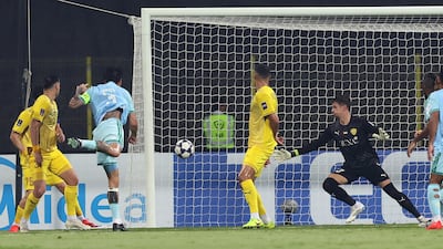 Roger Ibanez scores Al Ahli's first goal. Chris Whiteoak / The National
