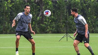 Inter Miami's Lionel Messi, right, and Sergio Busquets train. AFP