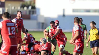 Dubai Tigers' Aaron Persico passes the ball out of the ruck. Chris Whiteoak / The National