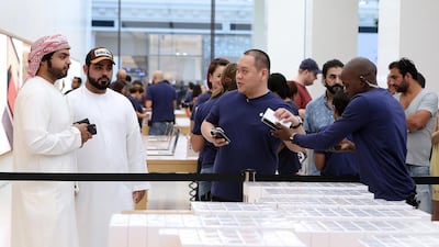 Telecoms companies Etisalat and du were also offering the phones to customers who had ordered them online. Pawan Singh / The National