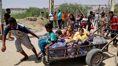 Displaced Iraqis from Ramadi cross the Bzebiz bridge fleeing fighting in Ramadi (AP Photo/ Karim Kadim)