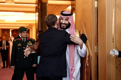 Saudi Crown Prince Mohammed bin Salman embraces French President Emmanuel Macron after a meeting at Al Yamamah Palace in Riyadh. AFP