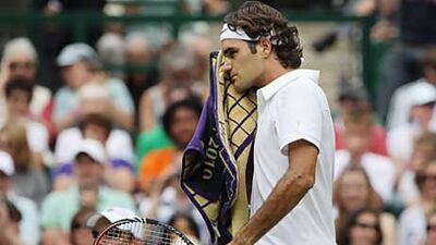 Roger Federer faced some anxious moments before coming from two sets down to beat Falla.