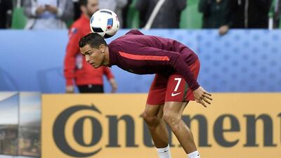 Portugal’s forward Cristiano Ronaldo warms prior to the start of the Euro 2016 group F football match between Portugal and Iceland at the Geoffroy-Guichard stadium in Saint-Etienne on June 14, 2016. Jeff Pachoud / AFP