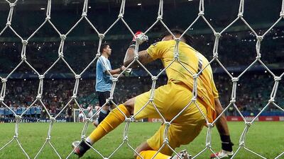 Peru goalkeeper Pedro Gallese celebrates after saving Luis Suarez's penalty during the shootout win against Uruguay in the Copa America quarter-finals. EPA