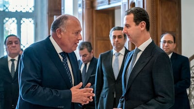 Sameh Shoukry speaks to Syrian President Bashar Al Assad during his visit to Damascus. AFP
