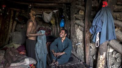 Miners rest in their rooms at the end of the day at a coal field in Choa Saidan Shah, Punjab. Sara Farid / Reuters