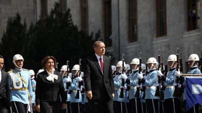 Turkey's new president Tayyip Erdogan (front) attends a swearing-in ceremony in front of the parliament building on August 28, 2014, in Ankara. Mr Erdogan was sworn in as Turkey's 12th president at a ceremony in parliament on Thursday, cementing his position as the country's most powerful modern leader, in what his opponents fear will herald an increasingly authoritarian rule. AFP Photo