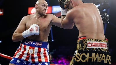 Tyson Fury, left, of England, tries to hit Tom Schwarz, of Germany, with a left during a heavyweight boxing match in Las Vegas. AP Photo