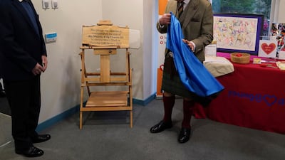 King Charles unveils a plaque in his honour during the visit in Aberdeenshire. AP