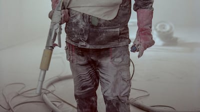 Master blaster Daniel Rausch wears a protective blasting suit that enables the operator to operate in the harsh environment that blasting creates.