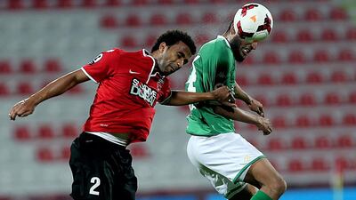 Al Ahli's Salmeen Khamis, left, and Al Shabab's Essa Obaid put their heads to some use in the 1-1 UAE League Cup match at the Rashid Stadium in Dubai on March 3, 2014. Satish Kumar / The National