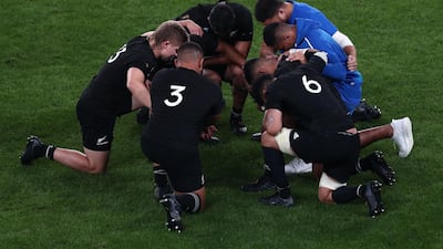 New Zealand's players pray after winning the Japan 2019 Rugby World Cup quarter-final match between New Zealand and Ireland at the Tokyo Stadium in Tokyo. AFP