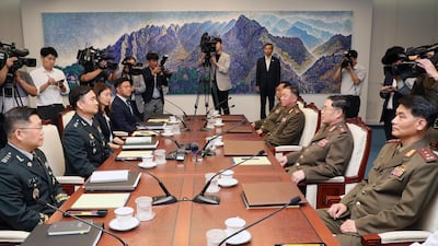 A handout photo made available by the South Korean Ministry of National Defense shows South Korea's chief delegate Major Gen. Kim Do-gyun (2-L) speaking with his North Korean counterpart Lt. Gen. An Ik-san (2-R) during the high-level inter-Korean military meeting at the Peace House on the southern side of the border truce village Panmunjom in Paju, South Korea. EPA / MINISTRY OF NATIONAL DEFENSE