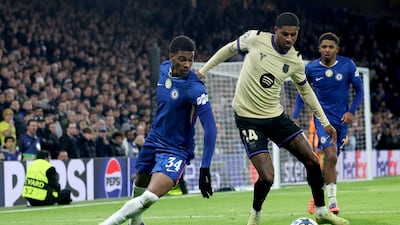 Joshua Acheampong, left, of Chelsea in action against Marcus Rashford of Barcelona. EPA