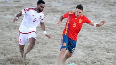 UAE's Kamal Ali and Spain's Francisco Jose Cintas battle during the game.