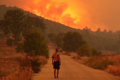 A resident looks on at the wildfire approaching the village of Avantas, northeast of Alexandroupolis, Greece, in August 2023. Getty Images