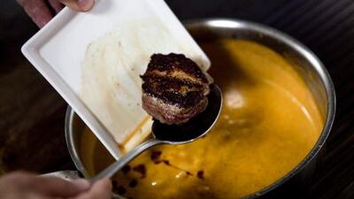5. Add the beef and the fish sauce to the curry sauce, making sure the fillets are generously coated, and heat through briefly.