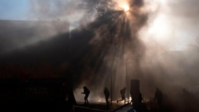 Demonstrators clash with riot police. AFP