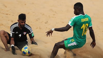 Senegal's Mamour Diagne vies for the ball against Mohamed Aljasmi of United Arab Emirates. EPA