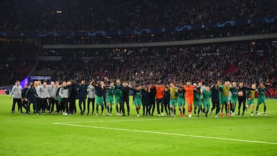 Tottenham players celebrate in front of their fans after the match. Getty