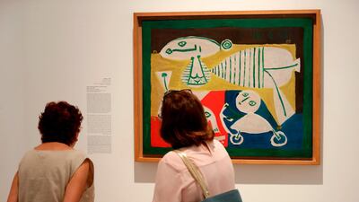 Visitors observe the artwork 'Mother and Children' (1951) by Spanish artist Pablo Picasso displayed at the Sursock Museum in Beirut. Joseph Eid / AFP